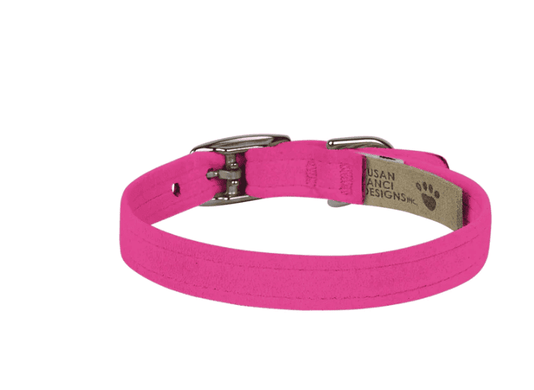 A dog collar in bright pink color with a metal buckle and adjustable strap, designed for fashionable pet accessories.